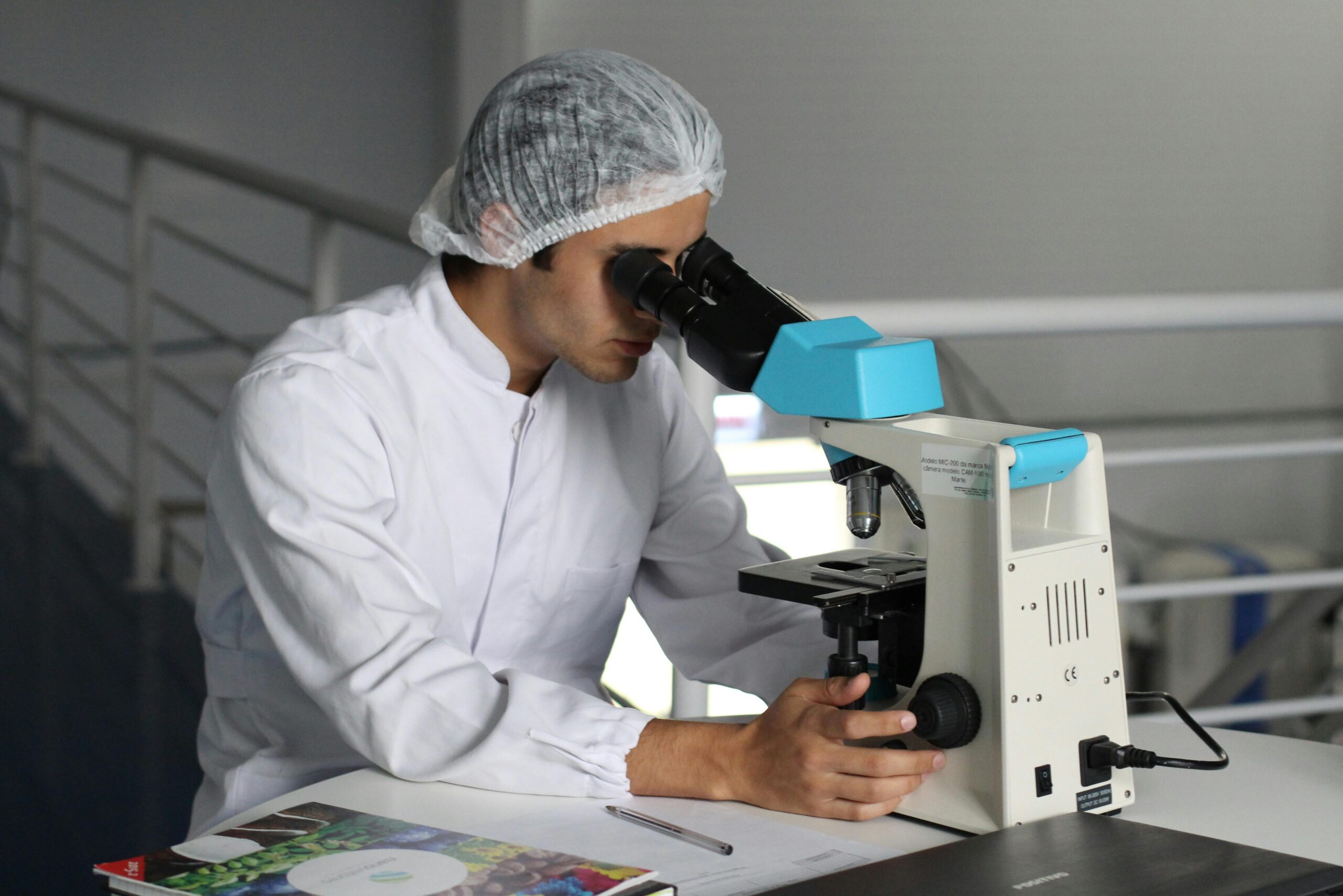 Shot of person looking into microscope for Registrar Corp Cosmetri customer case study, Cosmetics Lab Australia