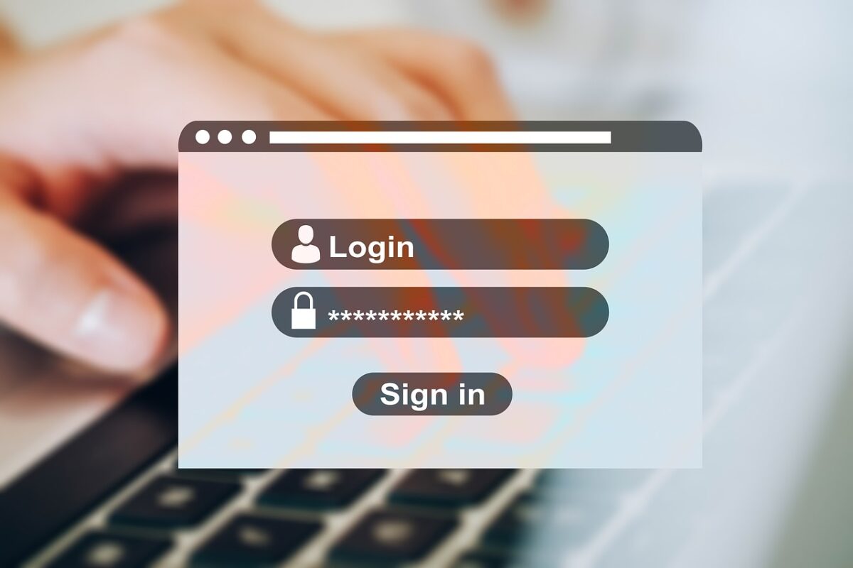 Picture of hand typing and login screen overlay